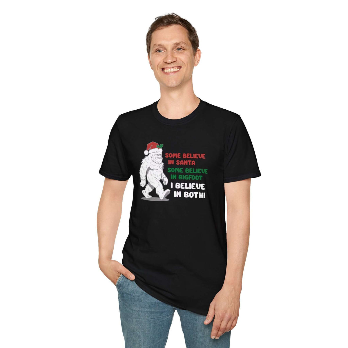 Believe in Santa and Bigfoot tee featuring a cheerful Bigfoot in a Santa hat with humorous text.