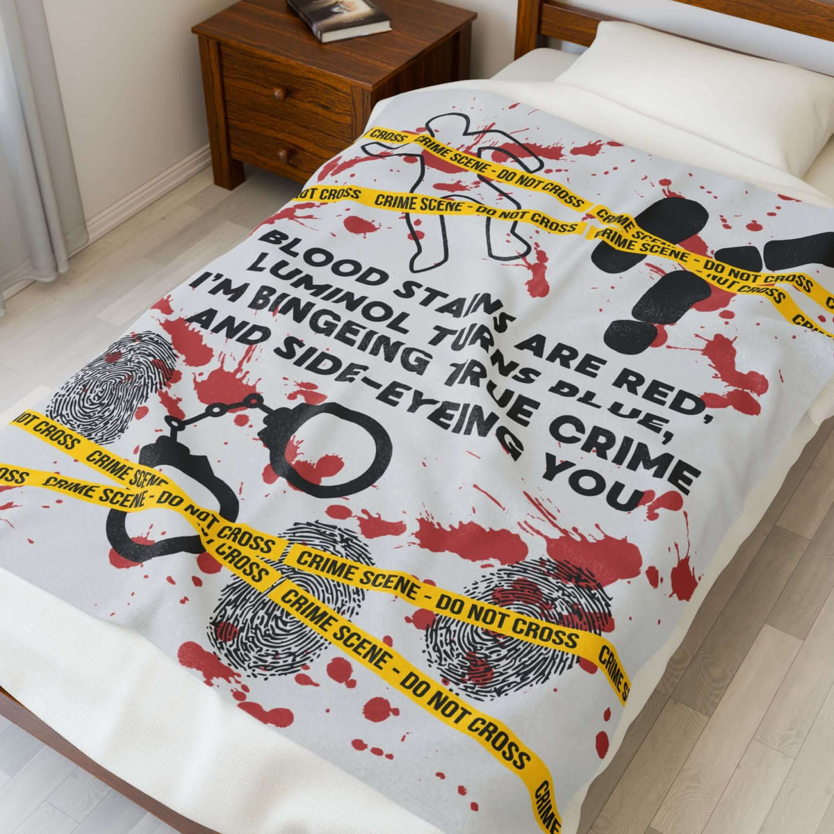 The Crime Scene Snuggle Lightweight Blanket for True Crime Lovers featuring crime scene design and clever poem.