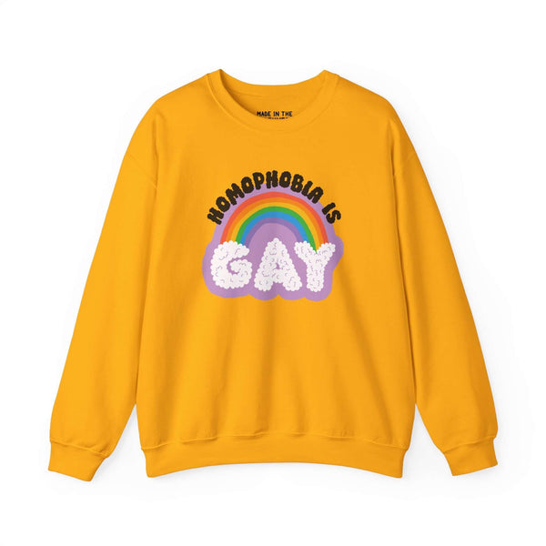 Homophobia Is Gay sweatshirt in vibrant yellow with rainbow and cloud design, promoting pride and positivity.