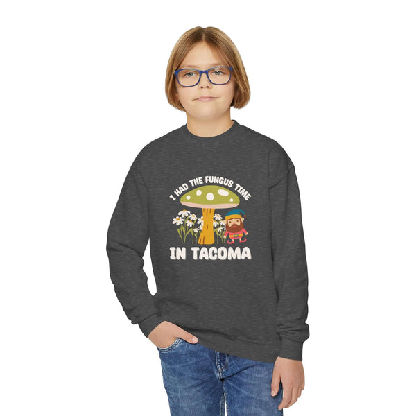 Kids sweatshirt with 'I Had the Fungus Time in Tacoma' design featuring a mushroom house and gnome.