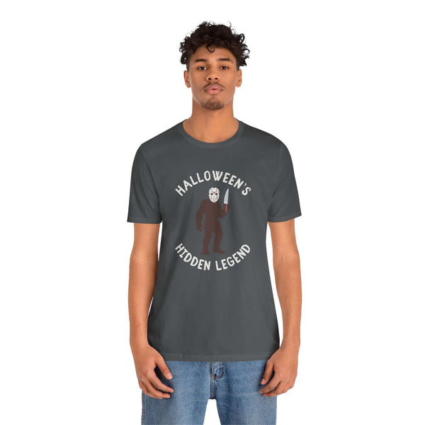 Halloween's Hidden Legend Bigfoot tee featuring Sasquatch dressed as Jason with a knife for spooky season.