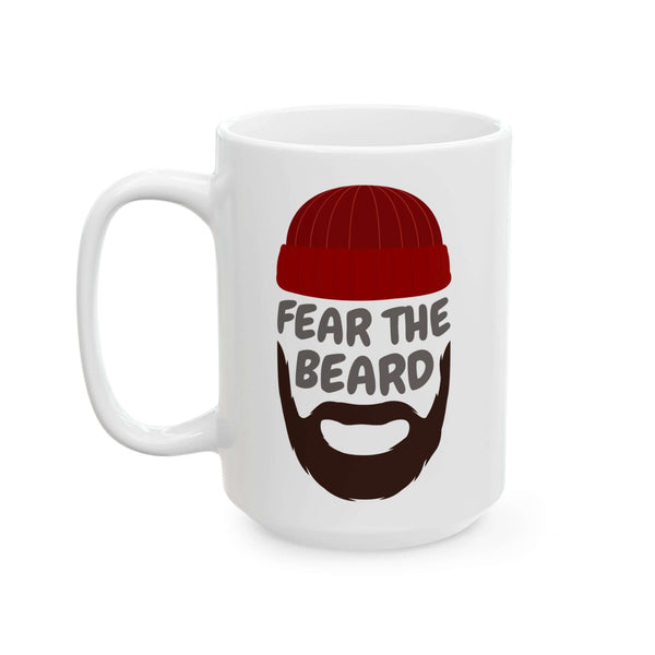Fear the Beard Mug featuring a bearded face and red beanie, perfect for coffee lovers who enjoy rustic charm.