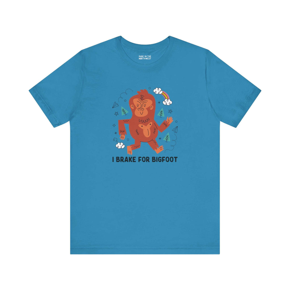 I Brake for Bigfoot Soft Tee Show your playful side and love for local folklore with our "I Brake for Bigfoot" Sasquatch Tee. This fun design features the phrase "I Brake for Bigfoot" alongside a whimsical graphic of a Sasquatch, perfect for those who enj