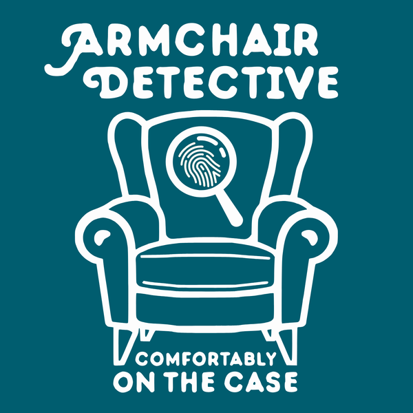 Armchair Detective T Shirt – Cozy True Crime Graphic Tee featuring an armchair and magnifying glass illustration.