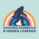 Chasing Rainbows and Hidden Legends tee featuring a Sasquatch graphic and vibrant rainbow design.