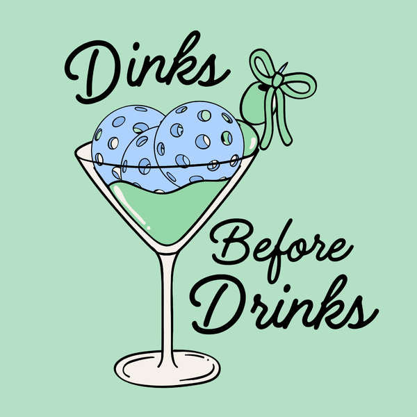 Dinks Before Drinks T Shirt with a playful illustration of a martini glass filled with pickleballs.