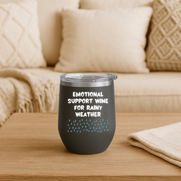 Emotional Support Wine for Rainy Weather PNW Wine Tumbler 12 oz on a wooden table with cozy decor.