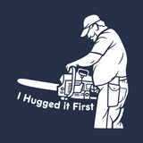 Unisex crewneck sweatshirt featuring a lumberjack with a chainsaw and the text 'I Hugged it First'