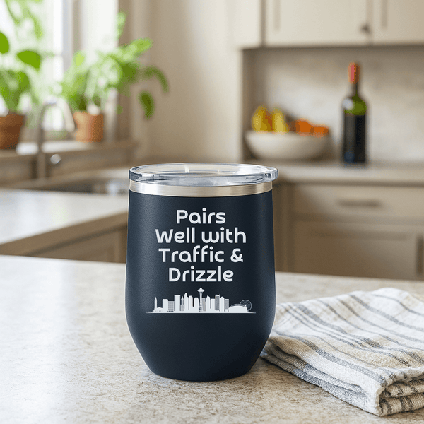 Pairs Well with Traffic and Drizzle Seattle PNW Wine Tumbler 12 oz on a kitchen counter with plants