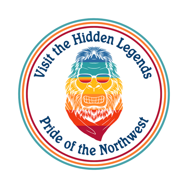 Colorful Bigfoot graphic with text 'Visit the Hidden Legends, Pride of the Northwest' for athletic tee.