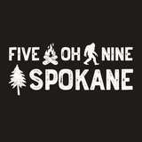 Five Oh Nine Roots Spokane Weekender Bag graphic featuring sasquatch, campfire, and tree designs.